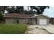 Charming single-story home featuring a well-maintained lawn and a classic garage door at 192 Tulane Rd, Venice, FL 34293
