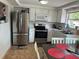 Modern kitchen features stainless steel appliances and a cozy dining area at 192 Tulane Rd, Venice, FL 34293