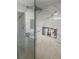 Modern shower featuring a marble tile surround and a rainfall shower head at 192 Tulane Rd, Venice, FL 34293