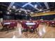 An auditorium with rows of tables and chairs set up for a community event in Kings Point at 2115 N Halcyon Dr # 510, Sun City Center, FL 33573