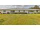 Spacious backyard features manicured lawn and mature hedges, providing privacy and a serene setting at 2115 N Halcyon Dr # 510, Sun City Center, FL 33573