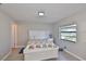 Inviting bedroom with a comfortable bed and a view of the outdoors at 2115 N Halcyon Dr # 510, Sun City Center, FL 33573