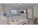 Bright bedroom featuring hardwood floors, closet, and natural light from the window at 2115 N Halcyon Dr # 510, Sun City Center, FL 33573