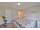 Cozy bedroom with a comfortable bed, rocking chair, and ensuite bathroom at 2115 N Halcyon Dr # 510, Sun City Center, FL 33573