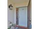 Charming front door with butterfly glass and security screen in a well-maintained home entrance at 2115 N Halcyon Dr # 510, Sun City Center, FL 33573