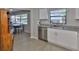 Bright kitchen featuring stainless steel appliances, white cabinets, and granite countertops at 2115 N Halcyon Dr # 510, Sun City Center, FL 33573