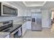 Modern kitchen featuring stainless steel appliances and granite countertops at 2115 N Halcyon Dr # 510, Sun City Center, FL 33573