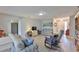 Spacious living room features wood floors, comfortable sofas, and a decorative cabinet offering ample space at 2115 N Halcyon Dr # 510, Sun City Center, FL 33573
