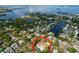 Aerial view of the property showcasing its waterfront location and surrounding neighborhood at 232 Pinecrest Dr, Palm Harbor, FL 34683