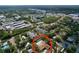 Aerial view of home with pool, surrounded by lush landscaping in a serene neighborhood at 232 Pinecrest Dr, Palm Harbor, FL 34683