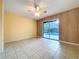 Bedroom with sliding glass doors to screened pool area and tile flooring at 232 Pinecrest Dr, Palm Harbor, FL 34683