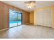 Bedroom has tile floors, a closet, a sliding door that leads to screened in pool area at 232 Pinecrest Dr, Palm Harbor, FL 34683