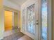 Bright entryway featuring a decorative glass door, tile flooring, and neutral paint, creating a welcoming atmosphere at 232 Pinecrest Dr, Palm Harbor, FL 34683