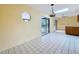 Bright living room has tile floors and views of pool area, with natural light from skylight at 232 Pinecrest Dr, Palm Harbor, FL 34683
