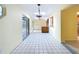 The bright living room features tile flooring and access to the screened-in lanai and pool area at 232 Pinecrest Dr, Palm Harbor, FL 34683