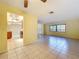 Open living space with tiled floors, access to kitchen, and plenty of natural light at 232 Pinecrest Dr, Palm Harbor, FL 34683