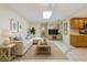 Inviting living room featuring natural light, modern furniture, and seamless flow to the kitchen at 232 Pinecrest Dr, Palm Harbor, FL 34683