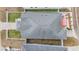 Aerial shot of the roof, fenced-in yard with patio, and neighboring house at 260 Sw Lincoln N Cir, St Petersburg, FL 33703