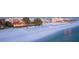 Expansive beachfront view showing pristine white sand, rows of blue beach umbrellas, and luxury hotels at 260 Sw Lincoln N Cir, St Petersburg, FL 33703