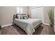 Bedroom with neutral decor, cozy carpet, and double closet with white doors and silver hardware at 260 Sw Lincoln N Cir, St Petersburg, FL 33703