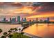 Stunning waterfront city skyline view at sunset, featuring palm trees and a picturesque bridge at 260 Sw Lincoln N Cir, St Petersburg, FL 33703