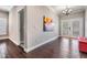Elegant foyer featuring wood floors, chandelier lighting, and glass insert front doors at 260 Sw Lincoln N Cir, St Petersburg, FL 33703