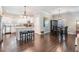 Bright kitchen with white cabinetry, stainless steel appliances, granite countertops and center island at 260 Sw Lincoln N Cir, St Petersburg, FL 33703
