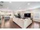 Open-concept space with dark wood floors, modern lighting, with views of the kitchen and dining area at 260 Sw Lincoln N Cir, St Petersburg, FL 33703