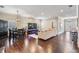 Spacious living room featuring wood floors, modern lighting, and a comfortable seating area at 260 Sw Lincoln N Cir, St Petersburg, FL 33703