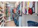 Spacious walk-in closet with extensive shelving and storage solutions for clothes, shoes, and accessories at 260 Sw Lincoln N Cir, St Petersburg, FL 33703