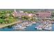 Picturesque waterfront scene with yachts docked, surrounded by lush greenery and elegant pink hotel at 260 Sw Lincoln N Cir, St Petersburg, FL 33703