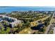 A wide aerial perspective showing the golf course, buildings, and landscape, emphasizing the community's charm at 2614 Cove Cay Dr # 409, Clearwater, FL 33760