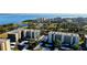 Elevated view showcasing the waterfront property, golf course, community buildings, and convenient parking at 2614 Cove Cay Dr # 409, Clearwater, FL 33760