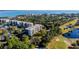Desirable community aerial view featuring golf courses, waterways, and residential buildings with convenient parking at 2614 Cove Cay Dr # 409, Clearwater, FL 33760