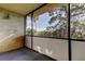 Inviting balcony with views of mature trees at 2614 Cove Cay Dr # 409, Clearwater, FL 33760