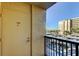 Balcony view showcasing the building exterior with covered parking and clear blue skies at 2614 Cove Cay Dr # 409, Clearwater, FL 33760