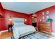 Stylish bedroom with an ensuite bathroom, accent wall, and sophisticated decor that create a cozy atmosphere at 2614 Cove Cay Dr # 409, Clearwater, FL 33760