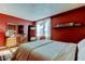 Stylish bedroom with a large window, accent wall, and sophisticated decor that create a cozy atmosphere at 2614 Cove Cay Dr # 409, Clearwater, FL 33760