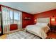 Stylish bedroom with a large window, accent wall, and sophisticated decor that create a cozy atmosphere at 2614 Cove Cay Dr # 409, Clearwater, FL 33760