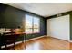 Cozy bedroom with a large window, closet, laminate floors and stylish green paint at 2614 Cove Cay Dr # 409, Clearwater, FL 33760