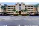 Inviting condominium building with covered parking and meticulously manicured landscaping at 2614 Cove Cay Dr # 409, Clearwater, FL 33760