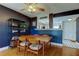 Dining room with a dark accent wall and shelving for storage and decor at 2614 Cove Cay Dr # 409, Clearwater, FL 33760