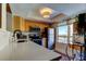 Kitchen with stainless steel appliances, light wood cabinets and a bright window with city views at 2614 Cove Cay Dr # 409, Clearwater, FL 33760