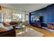 Bright living room with floor-to-ceiling windows and comfortable seating area at 2614 Cove Cay Dr # 409, Clearwater, FL 33760