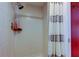 Shower featuring white tiles and a shower curtain at 2614 Cove Cay Dr # 409, Clearwater, FL 33760