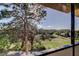 Balcony view overlooking lush greenery and a golf course, showcasing the outdoor scenery and natural light at 2614 Cove Cay Dr # 409, Clearwater, FL 33760