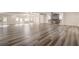 Expansive basement with new flooring, a stone fireplace, and plenty of room for entertainment and activities at 2679 Haines Bayshore Rd, Clearwater, FL 33760