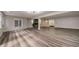 Spacious basement featuring french doors, a stone fireplace, and plenty of room for activities at 2679 Haines Bayshore Rd, Clearwater, FL 33760