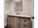 Modern bathroom vanity with drawers and sliding cabinet door at 2679 Haines Bayshore Rd, Clearwater, FL 33760