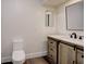 Bathroom featuring a modern vanity with a sliding door and marble countertop at 2679 Haines Bayshore Rd, Clearwater, FL 33760